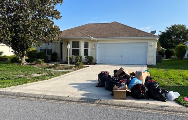 There was plenty of trash in the driveway on Friday at the home at 2082 Palo Alto Ave.
