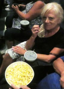 Villager Angie Rice has some popcorn while watching the Elvis biopic.