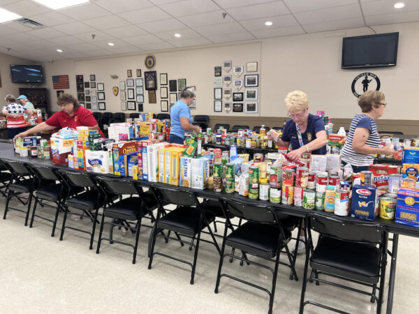 Volunteers sort the donated items at American Legion Post 347