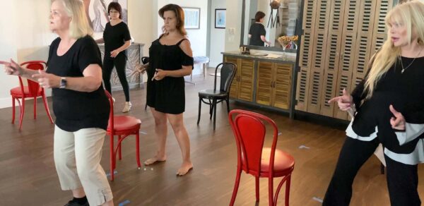 The women of Broadway Heroes and Villians work on some dance steps