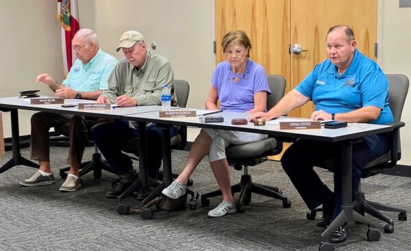 Chairman Craig Estep far right and his fellow commissioners approved the emergency declaration Monday morning