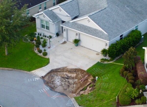 The sinkhole opened up Thursday at the end of a driveway at a home in the Village of Fernandina