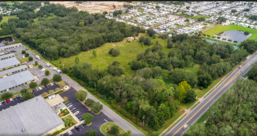 This wooded area on Rolling Acres Road could become home to a new apartment complex