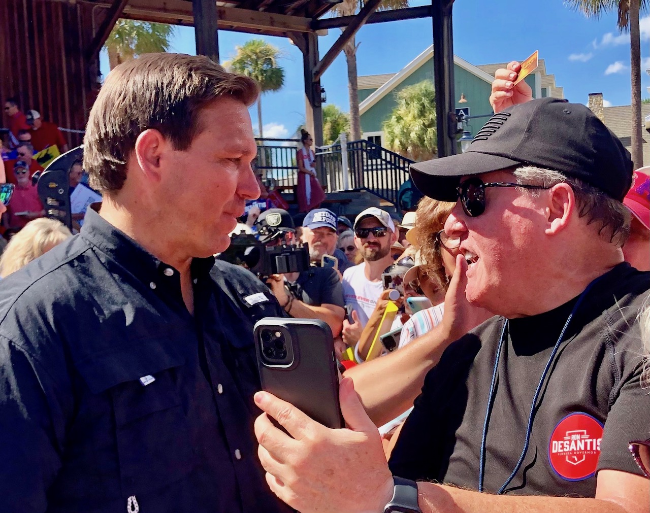 Gov. Ron DeSantis greets a member of the crowd Sunday at Bronwood Paddock Square