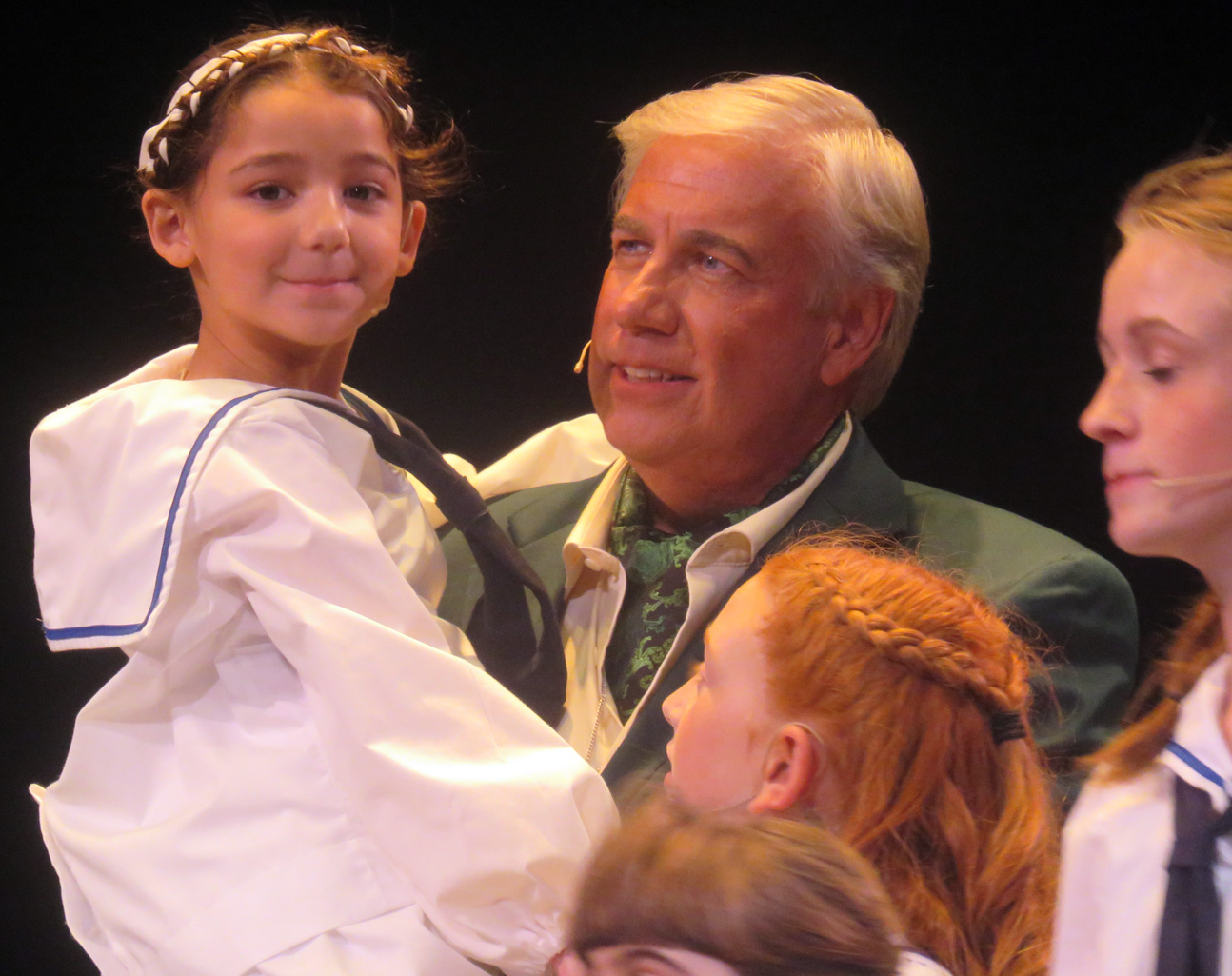 Camila Santana captures the audience as Gretl in the arms of her father played by Lee Mueller