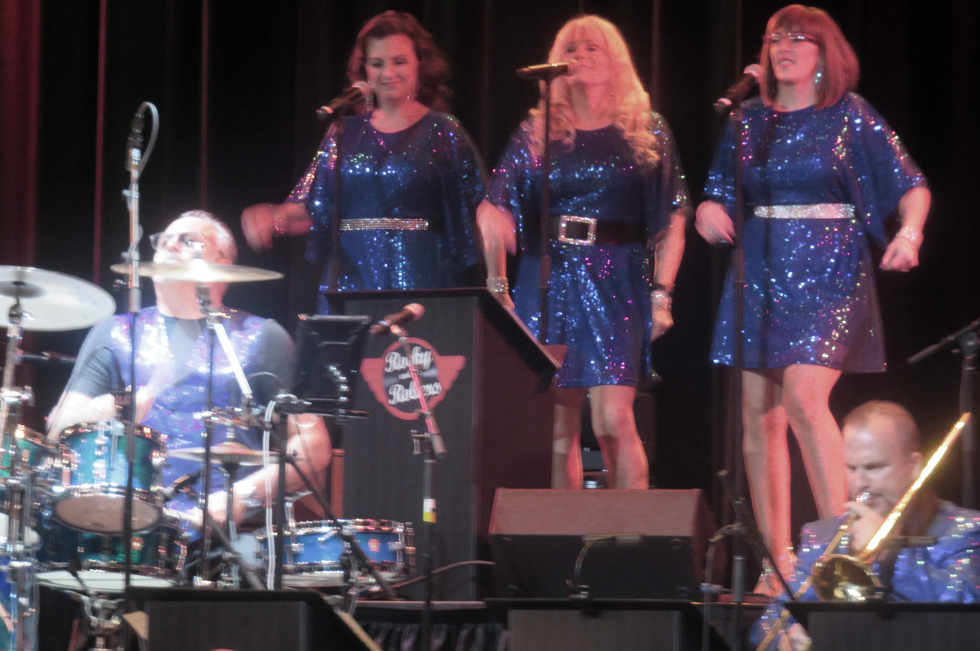 Gerry Rocky Seader plays the drums with his big band along with the female singers The Rolletts
