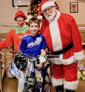 Nine year old Jesse Corley received a new bicycle from Santa Claus