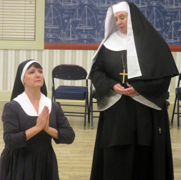Pinky Bigley left as Maria shares a spiritual moment with Bonnie Williams as Mother Abbess Pinky Bigley left as Maria shares a spiritual moment with Bonnie Williams as Mother Abbess