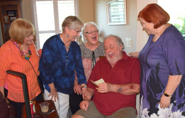 Villager Chuck Marcotte laughs as he receives a 221 million bill22 from members of the Puc Puggy DAR