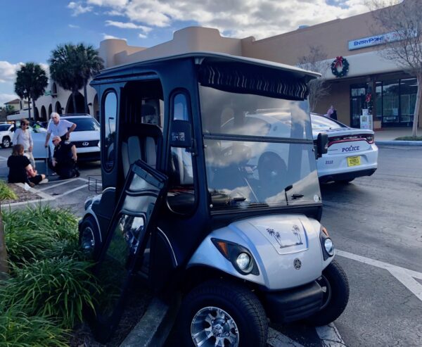 A woman driving this golf cart was ejected after it was hit by a sport utility vehicle at Publix at La Plaza Grande