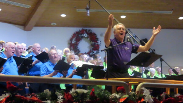 Billl Davis leads the Villages Pops Chorus in its annual holiday concert