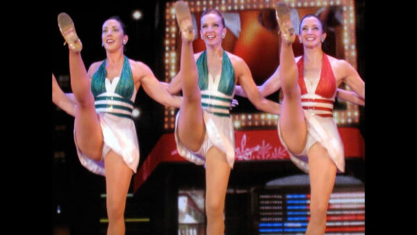 Lila LIng on the left kicks on stage as a Rockette