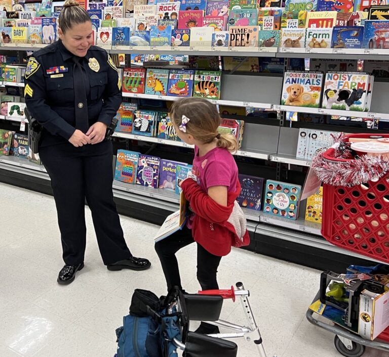 Sgt. Walsh helped a youg shopper select a book