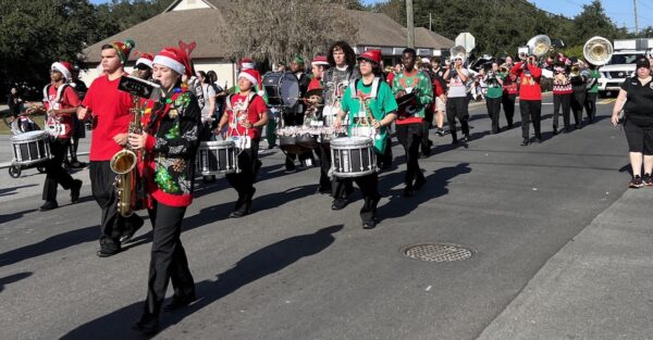 The Leesburg High School band Played Christmas tunes as they marched along. The Leesburg High School band played Christmas tunes as they marched along.