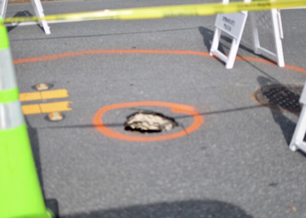An orange circle marked the hole in the roadway on Talley Ridge Drive