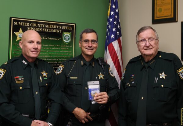 Newly promoted Capt. Robert Siemer center is flanked by Major Pat Breeden left and Sheriff Bill Farmer