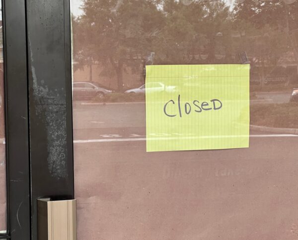 A sign on the door indicates Giovannis is closed