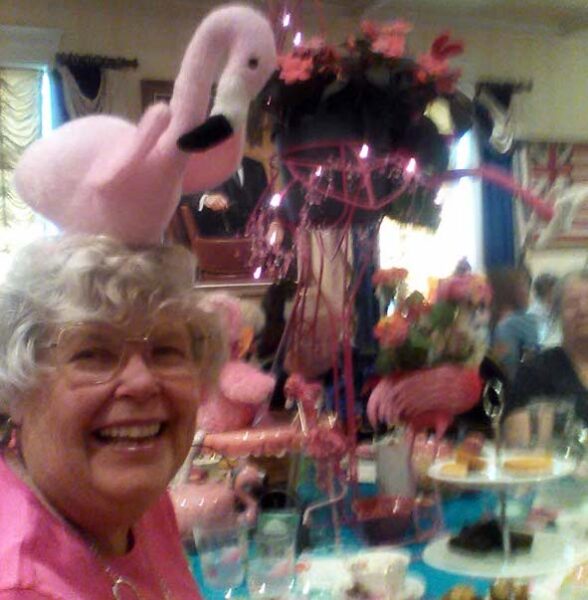Arlene Eckhardt shows off her flamingo hat at the Sunday Tea Club charity event
