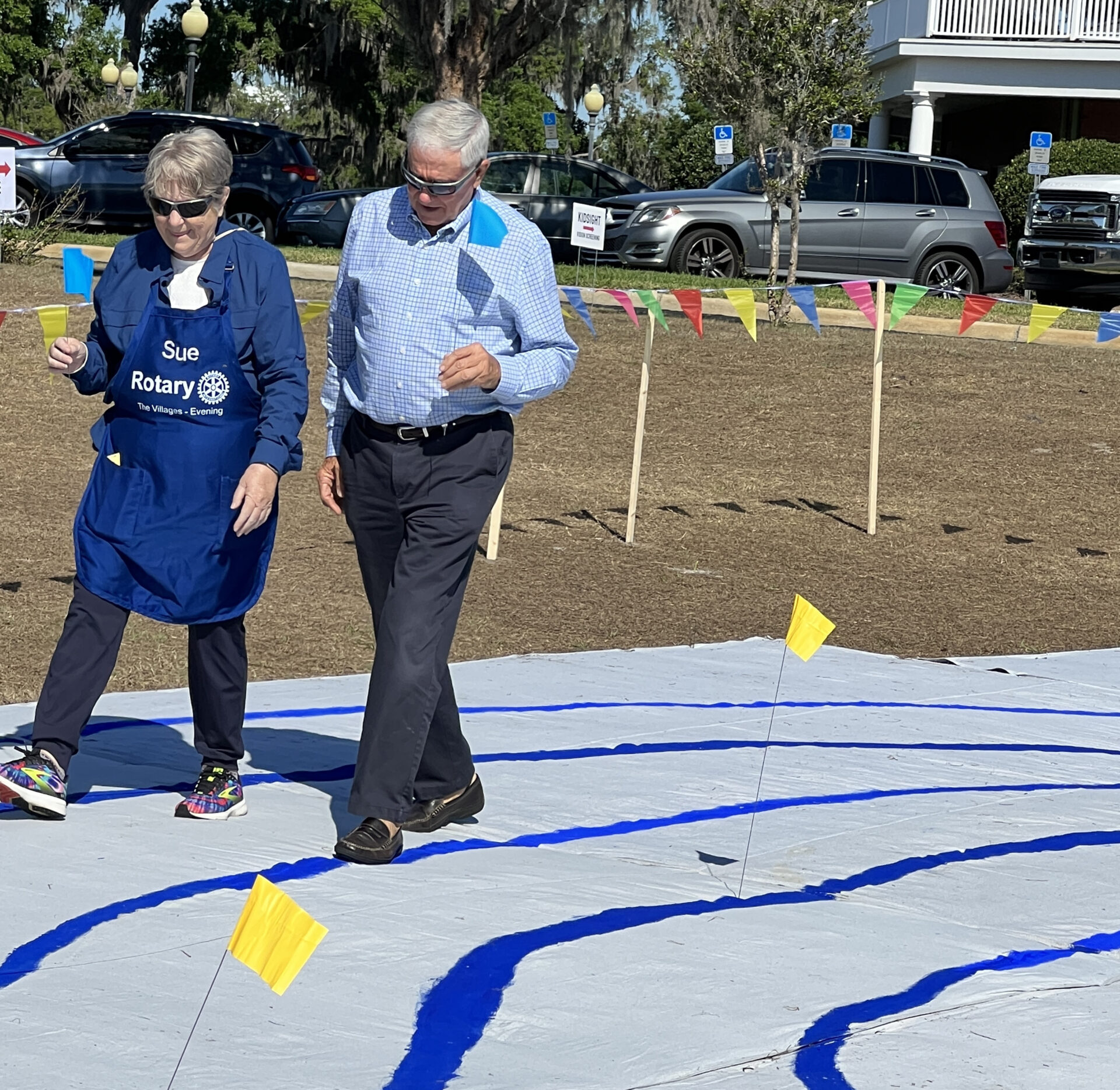 Mayor Ed Wolf walking the Labyrinth with club president, Sue Bodenner