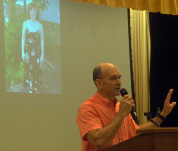 George Dorsett speaks under a picture of his wife Liz during a celebration of life for her Sunday at Eisenhower Recreation Center George Dorsett speaks under a picture of his wife Liz during a celebration of life for her Sunday at Eisenhower Recreation Center