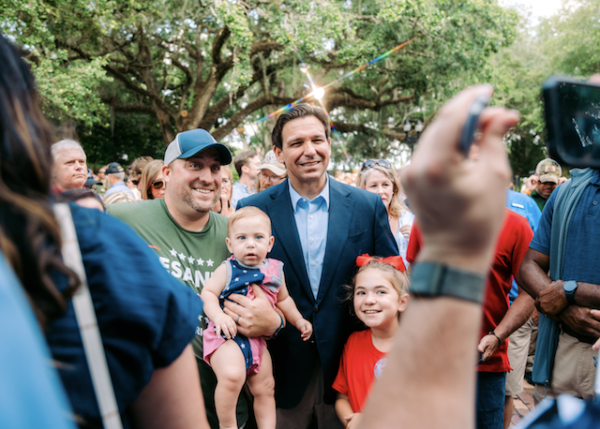 Gov. DeSantis poses for a photo during the BBQ.