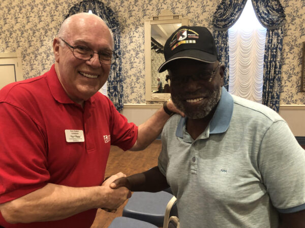 Supervisor Gary Kadow, left, welcomes Al Jenkins of the Village of Belvedere to Wednesday's town hall meeting at Laurel Manor Recreation Center