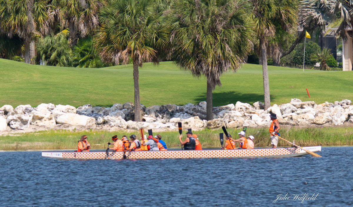 Dragon boat racing practice on a warm spring morning at Lake