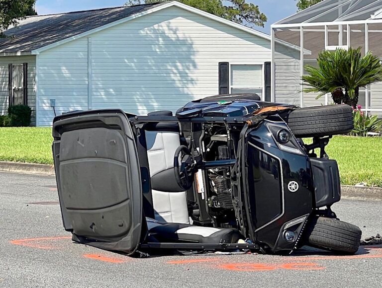 Golf cart driver traumatically injured in collision with vehicle