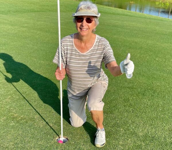 Barbara Jenkins gives the thumbs up after scoring a luckiy ace