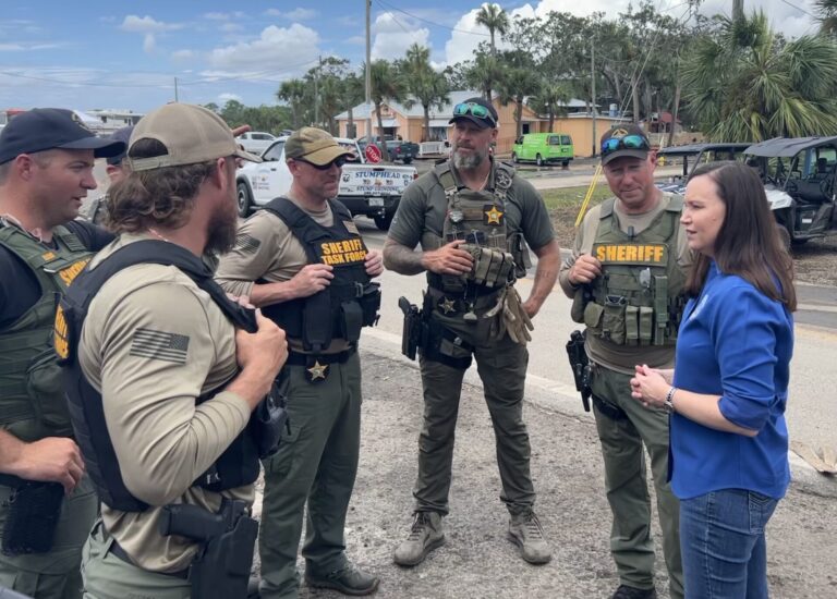 Ashley Moody with law enforcement after hurricane
