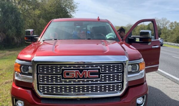 A man driving this GMC Sierra pickup truck was arrested for impersonating law enforcement.