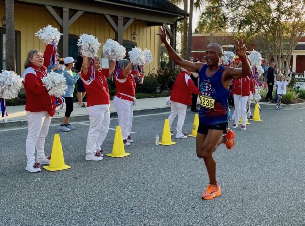 Albano Dos Reis crosses the finish line first.jpg. Albano Dos Reis crosses the finish line.