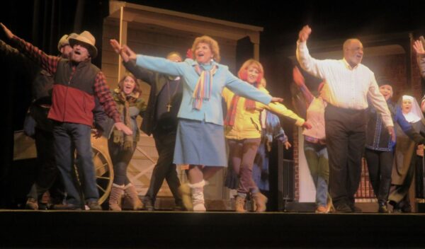 Bobbi Steele Marotta, center, and the cast of Grumpy Old Men in happy celebration