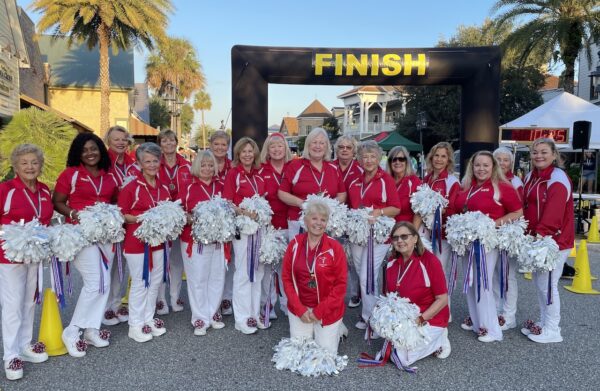 The Villages Cheerleaders were on hand to encourage the runners The Villages Cheerleaders were on hand to encourage the runners