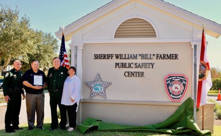 Undersheriff Pat Breeden, Commissioner Craig Estep, Sheriff Bill Farmer and his wife Linda Farmer, from left, at the dedication of the Sheriff Bill Farmer Public Safety Center.