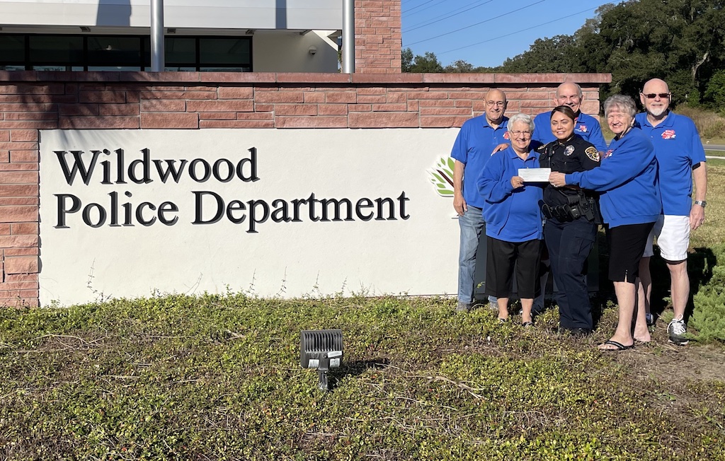 Officer Crystal Acevedo acepted the check from the Caring Hands ministry at First Baptist Church