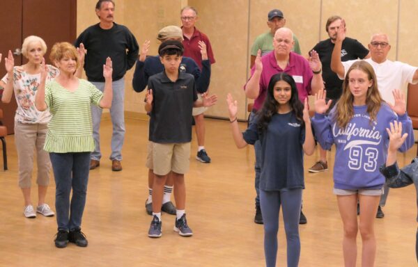 Part off the big cast rehearsing in Fiddler On the Roof