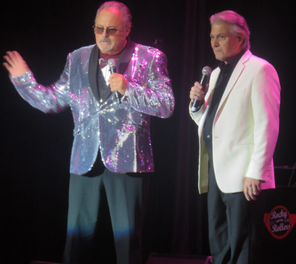 Rocky Seader and Dennis Tufano talk to the audience as Rocky tells the story of his broken toe