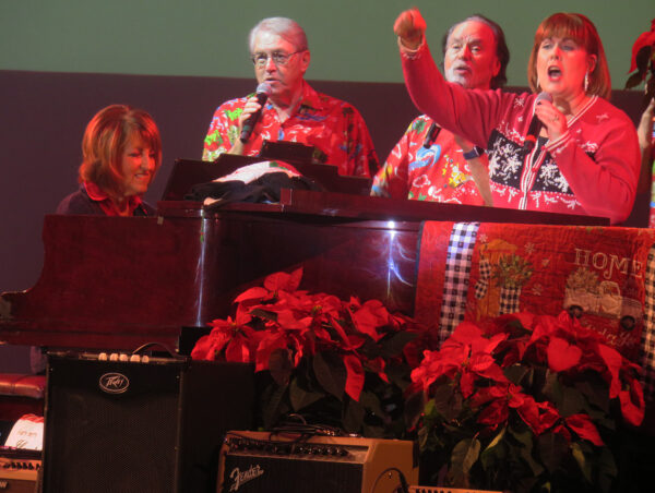 Sue Schuler, far right, joins Sara Kallioinen at piano and from left Bill Davis and Bill McGaughey for caroling Sue Schuler, far right, joins Sara Kallioinen at piano and from left Bill Davis and Bill McGaughey for caroling