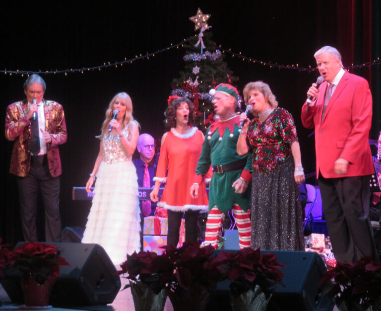 The cast of Carols by Candlelight gets into the Christmas spirit