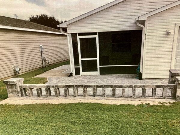 A homeowner in the Arlington Villas took down the picket fence and put up a block wall