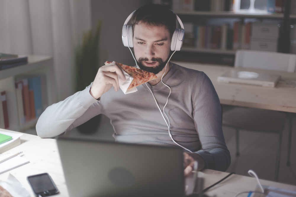 Man dining at home and networking