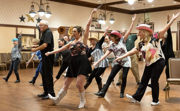 Dave Saxe (in black in front) and Dawn DiNome (black skirt) practice a dance sequence (Dave Boege photo)