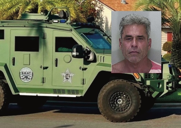 James Savage and a swat unit outside the home