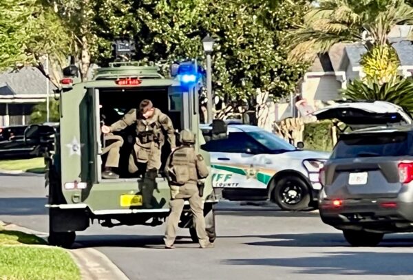 The SWAT team moved in on the home in which James Savage had reportedly barricaded himself The SWAT team moved in on the home in which James Savage had reportedly barricaded himself