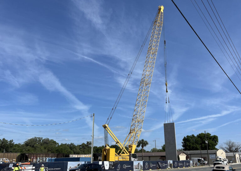 A crane in downtown Wildwood is used for the construction of the new downtown parking garage