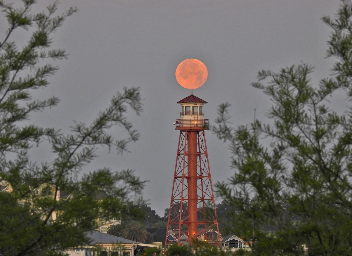 Full moon over the Lake Sumter Landing lighthouse