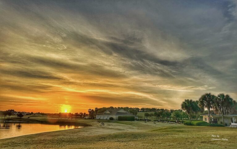 Golden dawn reflects on greens at Sarasota Golf Practice Center
