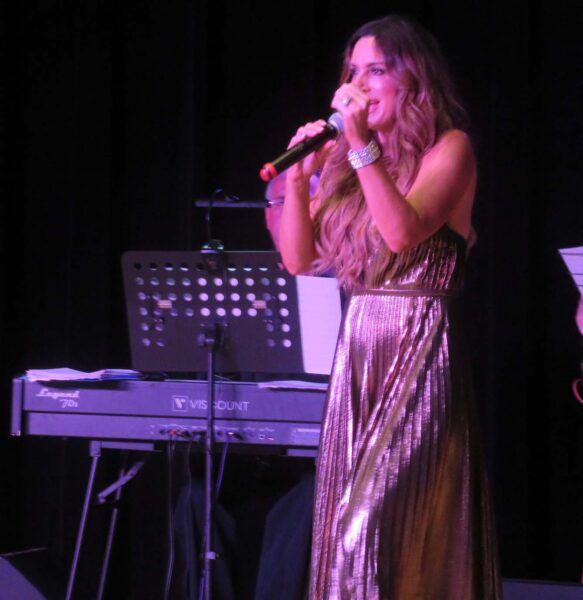 Jenene Caramielo performs for the Paisans Club.