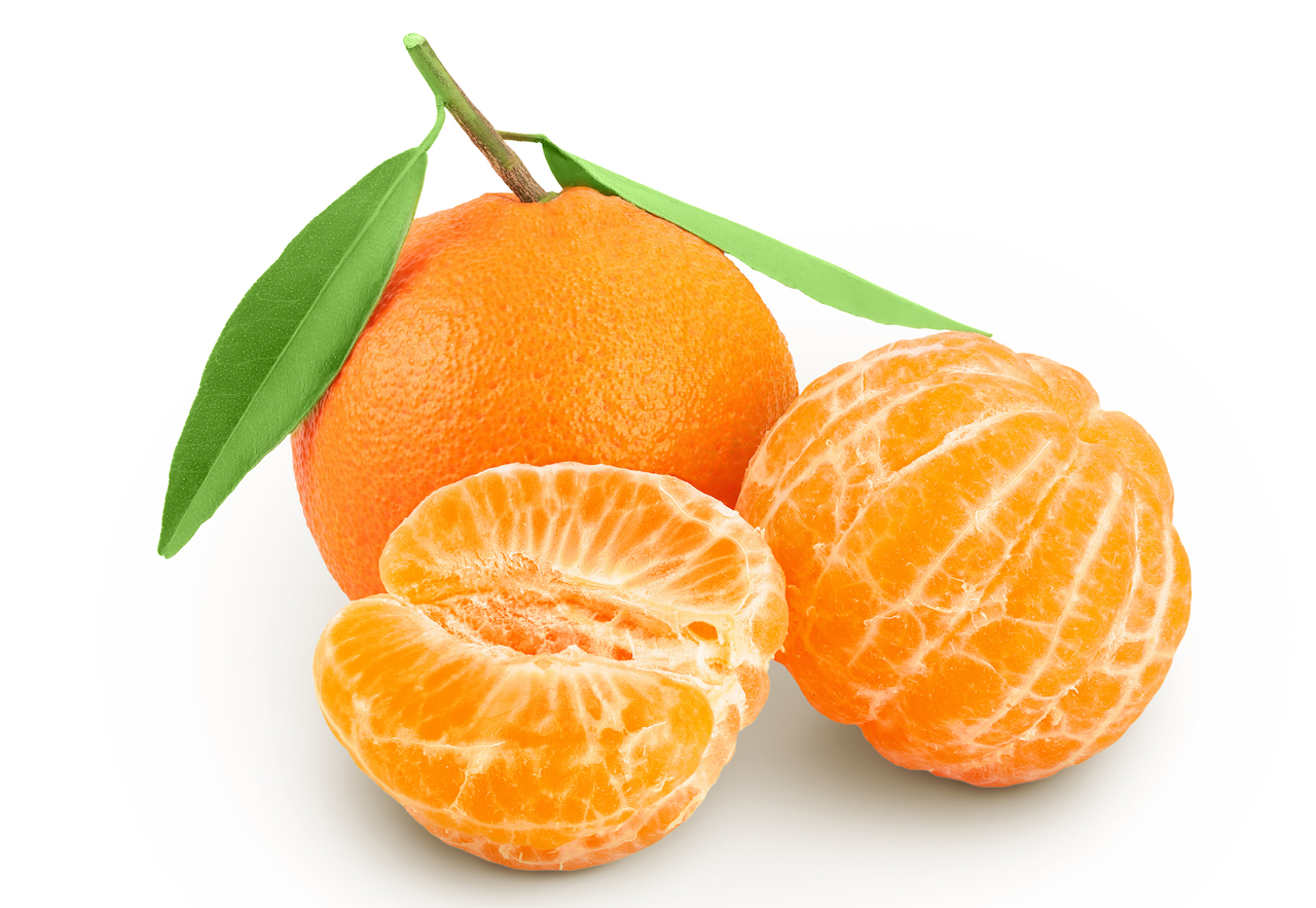 Tangerine or clementine with green leaf isolated on white background with full depth of field.